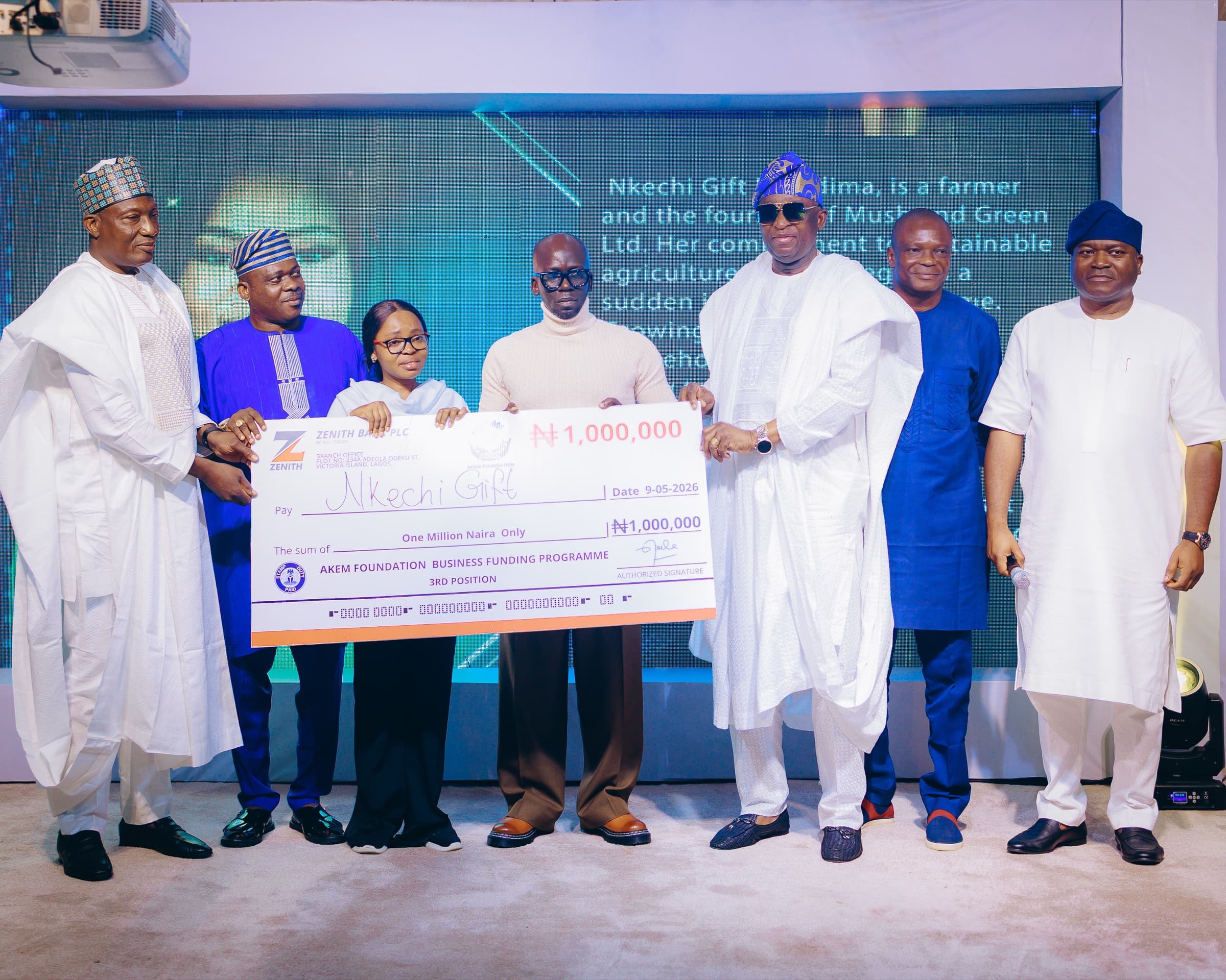 Nkechi Gift receiving an AKEM Foundation business grant