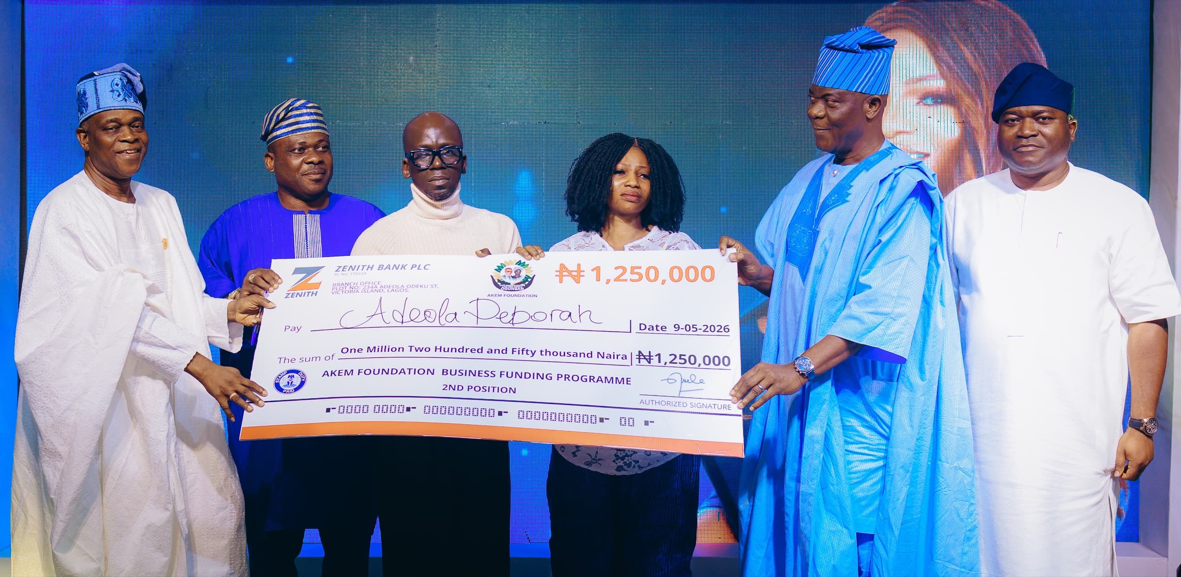 Adeola Deborah receiving an AKEM Foundation business grant