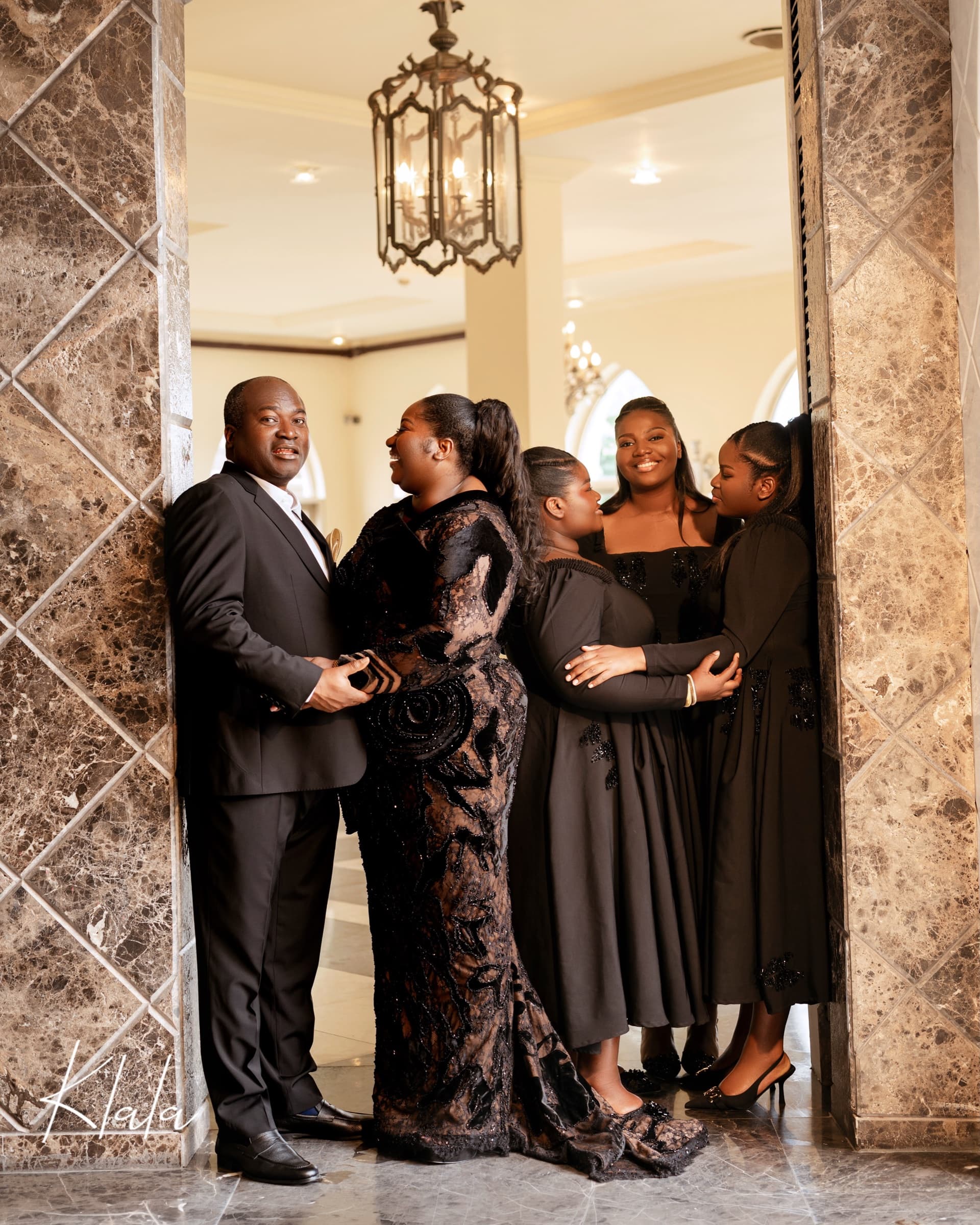 Dr. Ayo Ogunsan, his wife Dr. (Mrs) Ajoke Ogunsan and their daughters in a marble archway